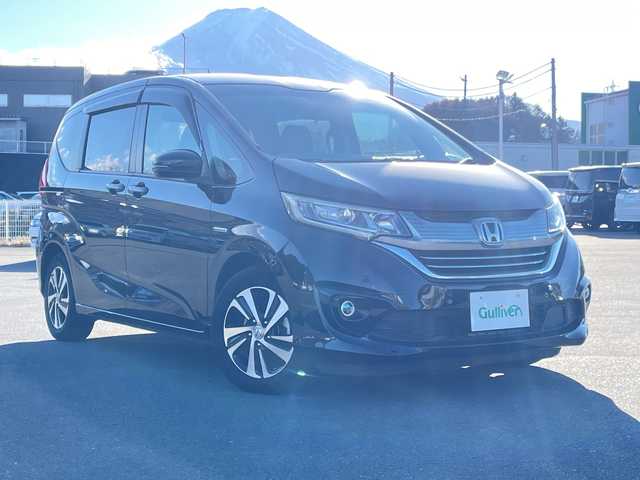 ホンダ フリード ハイブリット G ホンダセンシング 山梨県 2019(平31)年 5.8万km プレミアムスパークルブラックパール 社外カロッツェリアナビ　/フルセグ　/バックカメラ　/ETC　/両側パワースライドドア　/純正15インチアルミホイール　/ハーフレザーシート　/革巻きステアリング　/クルーズコントロール　/LEDライト