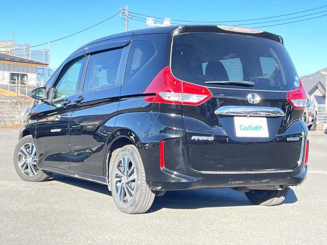 ホンダ フリード ハイブリット G ホンダセンシング 山梨県 2019(平31)年 5.8万km プレミアムスパークルブラックパール 社外カロッツェリアナビ　/フルセグ　/バックカメラ　/ETC　/両側パワースライドドア　/純正15インチアルミホイール　/ハーフレザーシート　/革巻きステアリング　/クルーズコントロール　/LEDライト