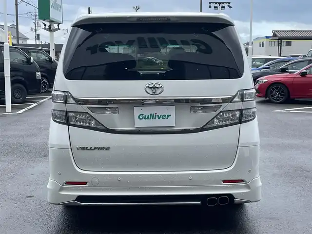 トヨタ ヴェルファイア 2．4Z Gエディション 長崎県 2013(平25)年 9.6万km パール 純正メモリナビ/CD/DVD/BT/フルセグTV/バックカメラ/純正フリップダウンモニター/両側パワースライドドア/クルーズコントロール/革調シートカバー/前席パワーシート/D席メモリーシート/モデリスタエアロ/パワーバックドア/ドライブレコーダー前後/社外レーダー/室内灯LEDヘッドライト/LEDヘッドライト/純正AW積み込み