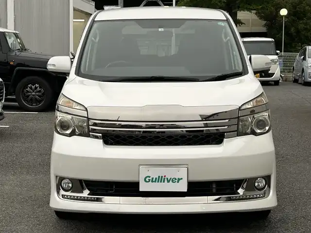 トヨタ ヴォクシー ZS G’s 静岡県 2010(平22)年 9.2万km 白 純性SDナビ（NHZN-W60G 76045）/ 【CD/DVD/BT/地デジTV】/純性LEDヘッドライト/社外16インチAW/G`sフロアマット/G`sエアロパーツ/ウォークスルー/バックカメラ/ETC/スマートキー/3列シート/Bluetooth接続/両側パワースライドドア/フルフラットシート/7人乗り/エンジンスタートボタン