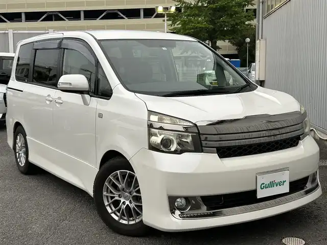 トヨタ ヴォクシー ZS G’s 静岡県 2010(平22)年 9.2万km 白 純性SDナビ（NHZN-W60G 76045）/ 【CD/DVD/BT/地デジTV】/純性LEDヘッドライト/社外16インチAW/G`sフロアマット/G`sエアロパーツ/ウォークスルー/バックカメラ/ETC/スマートキー/3列シート/Bluetooth接続/両側パワースライドドア/フルフラットシート/7人乗り/エンジンスタートボタン
