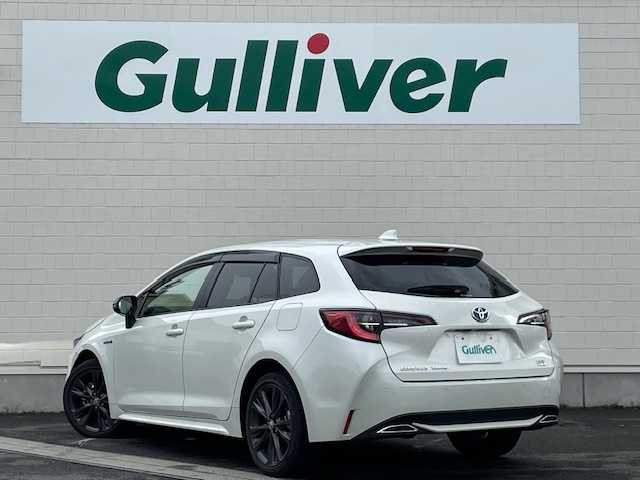 トヨタ カローラツーリング ハイブリッド ダブルバイビー 静岡県 2020(令2)年 6.3万km ホワイトパールクリスタルシャイン ●純正ディスプレイオーディオ（ナビ付き）/（12M66）/●バックカメラ/●レーダークルーズコントロール/●衝突軽減ブレーキ/●レーンキープアシスト/●前後コーナーセンサー/●オートブレーキホールド/●電動パーキングブレーキ/●LED/●オートライト/●オートマチックハイビーム/●革巻きステアリング/●ステアリングスイッチ/●電動格納ウインカーミラー/●ETC/●純正フロアマット/●ドアバイザー/●ドライブレコーダー/●プッシュスタート/●スマートキー/●スペアキー1本/●横滑り防止装置/●純正17インチアルミホイール/●W+サイド+カーテンSRS+ABS/●取扱説明書