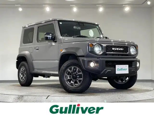 スズキ ジムニー シエラ JC 愛知県 2024(令6)年 0.3万km ミディアムグレー 社外８インチナビ/衝突軽減ブレーキ/シートヒーター/レーンキープアシスト/コーナーセンサー/クルーズコントロール/バックカメラ/ヘッドライトウォッシャー/ダウンヒアルアシスト/ＥＴＣ/ＬＥＤヘッドライト/純正フロアゴムマット/純正15インチアルミホイール/アイドリングストップ