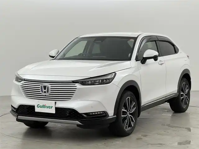 ホンダ ヴェゼル ハイブリッド e:HEV Z 福岡県 2022(令4)年 1.7万km プラチナホワイトパール 純正ナビ　/全方位カメラ　/置くだけ充電　/ビルトインETC２．０　/前後ドライブレコーダー　/アダプティブクルコン　/コーナーセンサー　/衝突被害軽減　/レーンキープ　/ＢＳＭ　/アクセル踏み間違い防止　/パワーバックドア　/シートヒーター　/ステアリングヒーター　/ＬＥＤヘッドライト