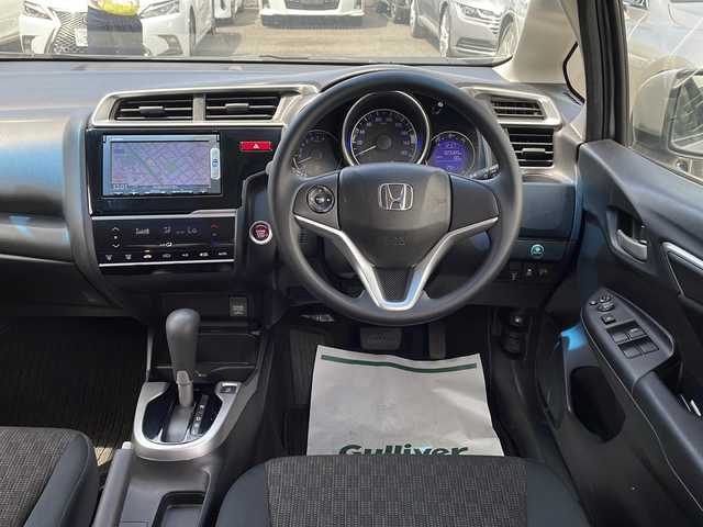ホンダ フィット 13G Fパッケージ 東京都 2015(平27)年 2.4万km アラバスターシルバーメタリック ワンオーナー/新車時保証書/取扱説明書【車両/ナビ】/アイドリングストップ/純正メモリーナビ/ワンセグTV【VXM-145VSi】/SD/CD/DVD/BT/USB/バックカメラ/純正ドライブレコーダー/Egプッシュスタート/ ストップボタン/スマートキー/ヘッドライトレベライザー