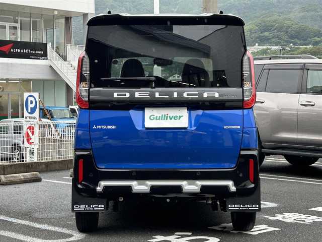 三菱 デリカミニ T プレミアム 長崎県 2023(令5)年 1.1万km 青Ⅱ ・プッシュスタート/・ディスプレイオーディオ（AM/FM/アンドロイドオート/アップルカープレイ）/・クルーズコントロール（追従有）/・両側パワースライドドア/・ダウンヒルアシストコントロール/・スマホ非接触充電/・ヒートシーター（D/N）/・ブルートゥース/・ハンドルヒーター/・オートライト/・オートハイビーム/・パーキングアシスト/・オートホールド/・ハンドルスイッチ/・パドルシフト/・デジタルインナーミラー