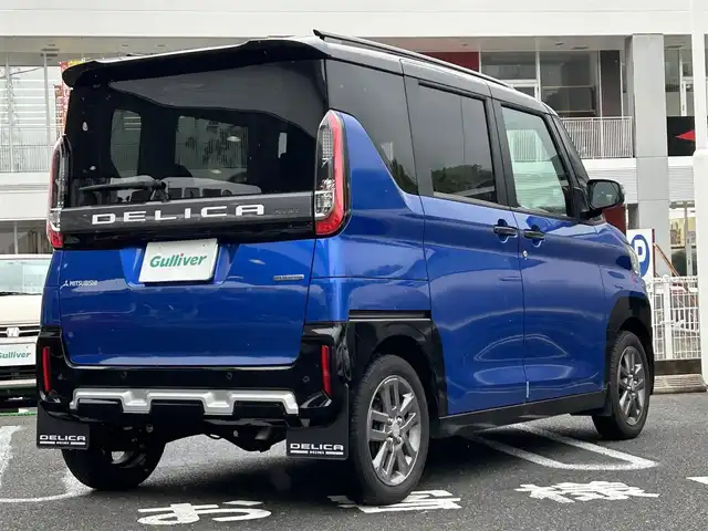 三菱 デリカミニ T プレミアム 長崎県 2023(令5)年 1.1万km 青Ⅱ ・プッシュスタート/・ディスプレイオーディオ（AM/FM/アンドロイドオート/アップルカープレイ）/・クルーズコントロール（追従有）/・両側パワースライドドア/・ダウンヒルアシストコントロール/・スマホ非接触充電/・ヒートシーター（D/N）/・ブルートゥース/・ハンドルヒーター/・オートライト/・オートハイビーム/・パーキングアシスト/・オートホールド/・ハンドルスイッチ/・パドルシフト/・デジタルインナーミラー