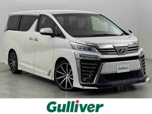 トヨタ ヴェルファイア Z Gエディション 福岡県 2018(平30)年 9.5万km ホワイトパールクリスタルシャイン ＴＲＤエアロ　/後席モニター　/純正１０型ナビ/フルセグTV　/バックカメラ　/ビルトインＥＴＣ　/ドライブレコーダー　/レーダークルコン　/コーナーセンサー　/衝突軽減ブレーキ　/レーンキープ　/両側電動スライドドア　/シートメモリー付きパワーシート　/シートベンチレーション／ヒーター　/ステアリングヒーター　/パワーバックドア　/３眼ＬＥＤヘッドライト　/社外２０インチアルミホイール