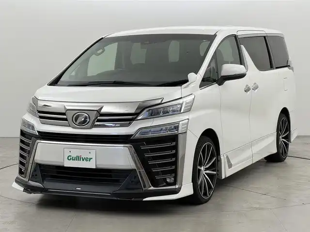 トヨタ ヴェルファイア Z Gエディション 福岡県 2018(平30)年 9.5万km ホワイトパールクリスタルシャイン ＴＲＤエアロ　/後席モニター　/純正１０型ナビ/フルセグTV　/バックカメラ　/ビルトインＥＴＣ　/ドライブレコーダー　/レーダークルコン　/コーナーセンサー　/衝突軽減ブレーキ　/レーンキープ　/両側電動スライドドア　/シートメモリー付きパワーシート　/シートベンチレーション／ヒーター　/ステアリングヒーター　/パワーバックドア　/３眼ＬＥＤヘッドライト　/社外２０インチアルミホイール