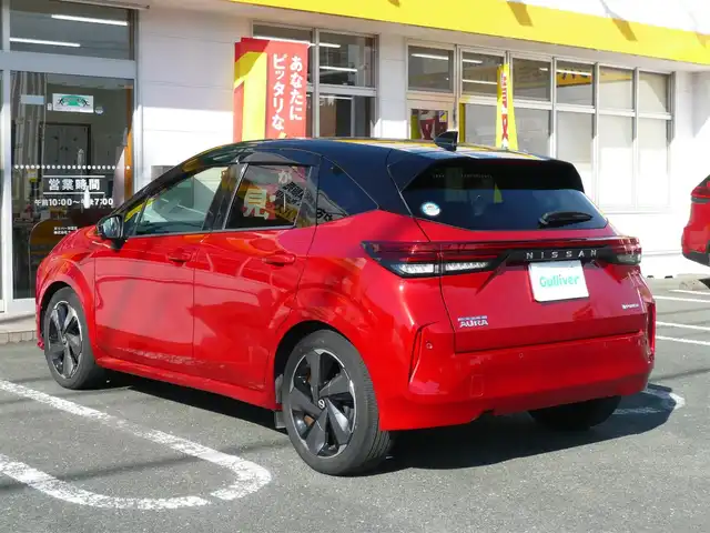 日産 オーラ G 静岡県 2022(令4)年 1.4万km ガーネットレッド/スーパーブラック 2トーン ワンオーナー/禁煙車/プロパイロット/・ハンドル支援/・レーダークルーズ/・レーンキープアシスト/ニッサンコネクトナビ/アラウンドビューモニター/フルセグテレビ/Bluetooth/USB・HDMI/置くだけ充電/デジタルインナーミラー/BOSEサウンド/オートハイビーム/オートライト/LEDヘッドライト/電動パーキング/AUTO HOLD/スマートキー/スペアキー/フロアマット/ドアバイザー/ビルトインETC/新車保証書/取扱説明書