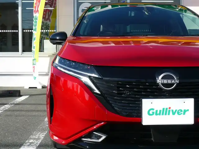 日産 オーラ G 静岡県 2022(令4)年 1.4万km ガーネットレッド/スーパーブラック 2トーン ワンオーナー/禁煙車/プロパイロット/・ハンドル支援/・レーダークルーズ/・レーンキープアシスト/ニッサンコネクトナビ/アラウンドビューモニター/フルセグテレビ/Bluetooth/USB・HDMI/置くだけ充電/デジタルインナーミラー/BOSEサウンド/オートハイビーム/オートライト/LEDヘッドライト/電動パーキング/AUTO HOLD/スマートキー/スペアキー/フロアマット/ドアバイザー/ビルトインETC/新車保証書/取扱説明書