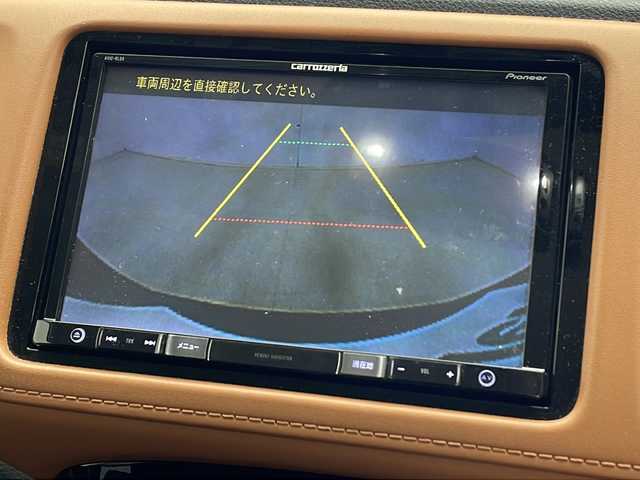 ホンダ ヴェゼル ハイブリッド Z 千葉県 2015(平27)年 4.8万km ルーセブラックM 社外ナビ【AVIC-RL09】/(CD/DVD/Bluetooth/フルセグ/SD/USB)/社外後席モニター/バックカメラ/クルーズコントロール/クリアランスソナー(前後)/電動パーキングブレーキ/オートホールド/LEDヘッドライト/フォグランプ/オートライト/シートヒーター(D+N席)/ETC/ハーフレザーシート/純正フロアマット/純正17インチアルミホイール/MTモード付AT/パドルシフト/トノカバー/電動格納ミラー/プッシュスタート/エアバッグ(W+サイド＋カーテン)/横滑り防止装置