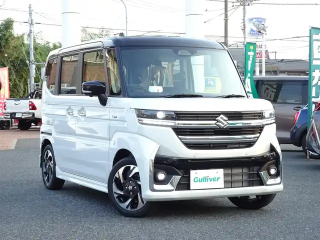 スズキ スペーシア カスタム HYBRID XS 千葉県 2025(令7)年 0.1千km ピュアホワイトパール/ブラック2トーン 【届出済未使用車】/【ピュアホワイトP/ブラック2トーン（C2H）】/LEDヘッドライト/LEDフォグランプ/ヘッドアップディスプレイ/スズキセーティサポート/両側パワースライドドア /ハーフレザーシート/シートヒーター/純正15インチAW/アダプティブクルーズコントロール/プッシュスタート/スマートキー2本/プレミアムUV/IRカットガラス/サイド/カーテンエアバッグ/保証書/取扱説明書/