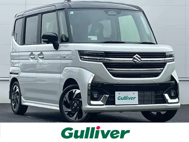 スズキ スペーシア カスタム HYBRID XS 佐賀県 2024(令6)年 0.1千km ピュアホワイトパール/ブラック2トーン デュアルカメラブレーキサポートII　/コーナーセンサー/レーダークルーズコントロール/純正９型ナビ/・全方位カメラ　/・フルセグTV/BT/・AppleCarPlay/AndroidAuto/両側パワースライドドア　/ハーフレザーシート/シートヒーター　/オットマン　　/純正15インチAW　/HUD　/電動パーキングブレーキ/革巻きステアリング/ステアリングヒーター/サーキュレーター/LEDヘッドライト/フォグランプ/スペアキー×１/取扱説明書/保証書