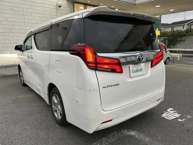 トヨタ アルファード X サイドリフトアップ 埼玉県 2023(令5)年 1.4万km ホワイトパールクリスタルシャイン 純正ナビ（AM/FM/BT）/トヨタセーフティセンス/プリクラッシュセーフティ/横滑り防止装置/レーダークルーズコントロール/レーンキープアシスト/バックカメラ/ビルトインETC2.0/コーナーセンサー前後/純正ドアバイザー/純正フロアマット/両側パワースライドドア/ドライブレコーダー前後/革巻きステアリング/ステアリングリモコン/電動パーキング/ブレーキホールド/MTモード付AT/純正LEDヘッドライト/オートライト/フォグランプ/電動格納ミラー/ウィンカーミラー/スペアキー1本/プッシュスタート/スマートキー