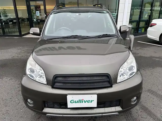 トヨタ ラッシュ G Lパッケージ 東京都 2012(平24)年 4.8万km ブロンズオリーブパールメタリック ４WD/ETC/ドアバイザー/サイドステップ/革巻きステアリング/電動格納ミラー/純正フロアマット/フォグライト/背面タイヤ