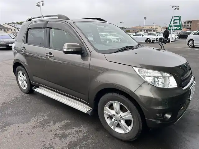 トヨタ ラッシュ G Lパッケージ 東京都 2012(平24)年 4.8万km ブロンズオリーブパールメタリック ４WD/ETC/ドアバイザー/サイドステップ/革巻きステアリング/電動格納ミラー/純正フロアマット/フォグライト/背面タイヤ