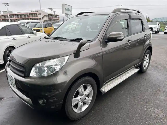 トヨタ ラッシュ G Lパッケージ 東京都 2012(平24)年 4.8万km ブロンズオリーブパールメタリック ４WD/ETC/ドアバイザー/サイドステップ/革巻きステアリング/電動格納ミラー/純正フロアマット/フォグライト/背面タイヤ