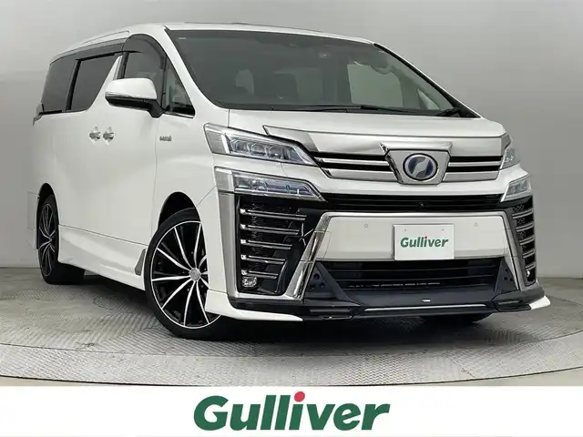 トヨタ ヴェルファイア ハイブリット ZR Gエディション 道央・札幌 2018(平30)年 8.4万km ホワイトパールクリスタルシャイン ・４WD/・TRDエアロ/・サンルーフ/・JBLプレミアムサウンド/・純正ディスプレイオーディオ/　BT/USB/Miracast/フルセグ/・純正フリップダウンモニター/・パノラミックビューモニター/・ビルトインETC2.0/・前後ドライブレコーダー/・社外レーダー/・100V/1500W/・プリクラッシュセーフティ/・レーダークルーズコントロール/・レーンキープアシスト/・オートハイビーム/・BSM/・PKSB/・RCTA/・RSA/・nanoe/・レザーシート/・パワーシート/・前席エアシート/・全席シートヒーター/・ステアリングヒーター/・ステアリングスイッチ/・LEDヘッドライト/・フォグライト/・オートライト/・プッシュスタート/・スマートキー/・純正フロアマット/・ドアバイザー/・保証書/・取扱説明書/・