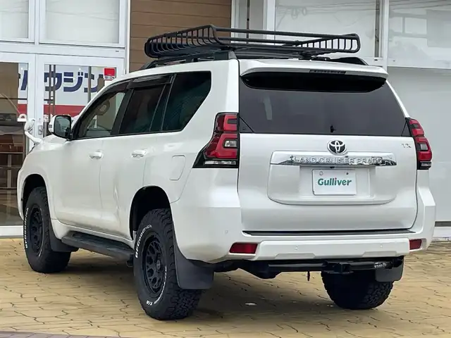 トヨタ ランドクルーザー プラド TX 宮崎県 2018(平30)年 3.3万km ホワイトパールクリスタルシャイン 4WD/RAYS17インチAW/社外7インチナビ（MDV-Z701W）/フルセグTV/Bluetooth/バックカメラ/プリクラッシュセーフティ/レーダークルーズコントロール/プッシュスタート/スマートキー/ステアリングスイッチ/LEDヘッドライト/オートライト/オートハイビーム/ETC/セーフティセンス/レーンディパーチャーアラート/ヒッチメンバー