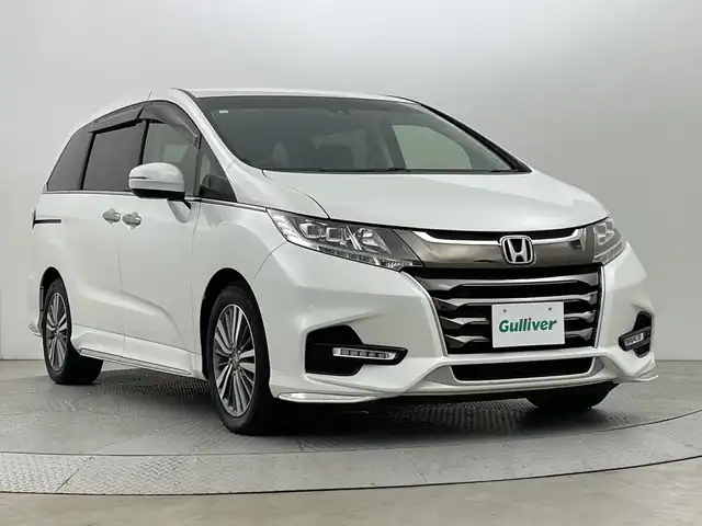 ホンダ オデッセイ G エアロ ホンダセンシング 新潟県 2018(平30)年 7.6万km プラチナホワイトパール ワンオーナー/純正９インチメモリナビ/フルセグ/　CD/DVD/Bluetooth/VXM-187FNi/バックカメラ/両側パワースライドドア/スマートキー×２/衝突被害軽減ブレーキ/レーダークルーズコントロール/LEDヘッドライト/オートライト/ETC2.0/フォグランプ/レーンアシスト/プッシュスタート/社外アルミ付きスタッドレス/　（積み込み７mm）