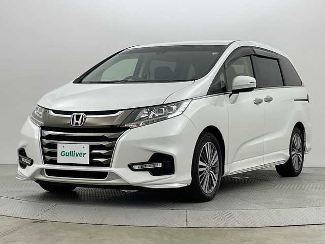 ホンダ オデッセイ G エアロ ホンダセンシング 新潟県 2018(平30)年 7.6万km プラチナホワイトパール ワンオーナー/純正９インチメモリナビ/フルセグ/　CD/DVD/Bluetooth/VXM-187FNi/バックカメラ/両側パワースライドドア/スマートキー×２/衝突被害軽減ブレーキ/レーダークルーズコントロール/LEDヘッドライト/オートライト/ETC2.0/フォグランプ/レーンアシスト/プッシュスタート/社外アルミ付きスタッドレス/　（積み込み７mm）