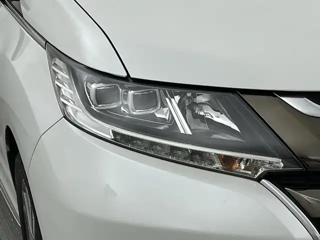 ホンダ オデッセイ G エアロ ホンダセンシング 新潟県 2018(平30)年 7.6万km プラチナホワイトパール ワンオーナー/純正９インチメモリナビ/フルセグ/　CD/DVD/Bluetooth/VXM-187FNi/バックカメラ/両側パワースライドドア/スマートキー×２/衝突被害軽減ブレーキ/レーダークルーズコントロール/LEDヘッドライト/オートライト/ETC2.0/フォグランプ/レーンアシスト/プッシュスタート/社外アルミ付きスタッドレス/　（積み込み７mm）