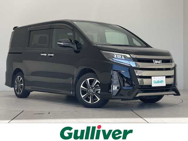 トヨタ ノア Si ダブルバイビー 愛知県 2018(平30)年 5.7万km ブラック 純正9型ナビ/後席モニター/両側パワースライドドア/クルーズコントロール/バックカメラ/純正アルミホイール/LEDヘッドライト/リアオートエアコン/オートマチックハイビーム/ETC/衝突軽減システム/フルセグ/CD DVD/Bluetooth/ステアリングスイッチ/スマートキー/プッシュスタート