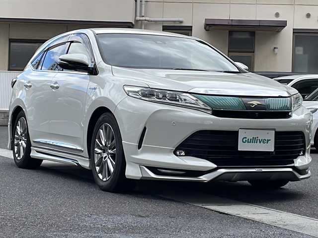 トヨタ ハリアー ハイブリッド プログレス メタル&レザーP 岡山県 2019(平31)年 6.3万km ホワイトパールクリスタルシャイン 登録時走行距離63079km/純正メーカーナビ/ＪＢＬサウンドシステム/モデリスタエアロ/革シート/バック・サイドカメラ/ビルトインETC/フルセグTV/前席シートヒーター＆エアシート/後方コーナーセンサー/前席パワーシート/プッシュスタート/スマートキー/純正フロアマット/保証書/取扱説明書/スペアキー