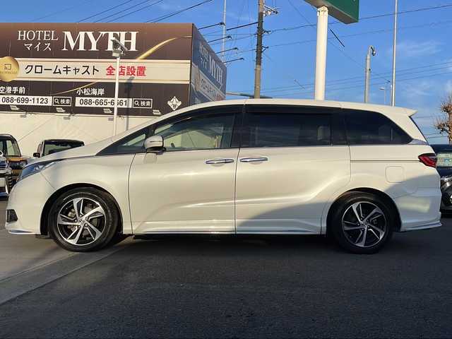 ホンダ オデッセイ アブソルート・Xホンダセンジング 徳島県 2017(平29)年 4.4万km ホワイトオーキッドパール 純正8型SDナビ　VXM-185VFEi/（ラジオ/フルセグ/DISC/SD/BT/USB）/バックカメラ/純正9型フリップダウンモニター/ホンダセンシング/追従式クルーズコントロール/ビルトインETC/ハーフレザーシート/両側電動スライドドア/パドルシフト/純正17AW/プッシュスタート/スマートキー/ドアバイザー/フォグライト/オートライト/純正フロアマット