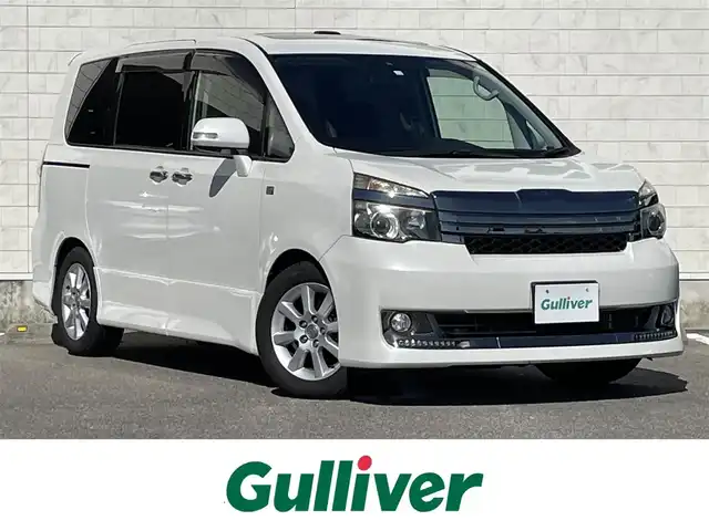 トヨタ ヴォクシー ZS G’s 宮崎県 2012(平24)年 5.4万km ホワイトパールクリスタルシャイン 社外ナビ「AVIC-ZH07」/(AM.FM.Bluetooth.DVD.CD.AUX)/フルセグTV/バックカメラ/両側パワースライドドア/サンルーフ/ETC/パドルシフト/オートライト/オートエアコン/電格ミラー/スマートキー/スペアキー/プッシュスタート/ステアリングスイッチ