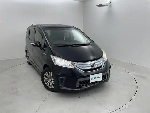 ホンダ フリード ハイブリット ジャストセレクション 茨城県 2012(平24)年 10.6万km プレミアムブラキッシュパール 社外ナビ/フルセグ視聴可能/寒冷地仕様/スペアキー/クルコン/Bluetooth/純正フロアマット/純正アルミホイール