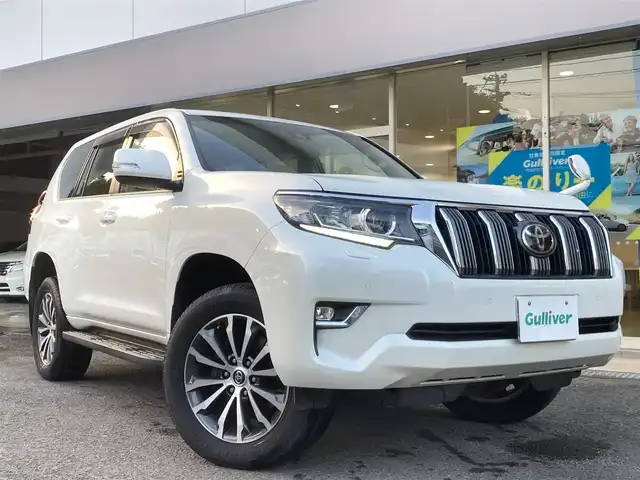 トヨタ ランドクルーザー プラド TX Lパッケージ 長崎県 2018(平30)年 6.3万km ホワイトパールクリスタルシャイン トヨタセーフティセンス/・衝突被害軽減ブレーキ/・レーダークルーズコントロール/・レーンキープアシスト/・オートマチックハイビーム/革シート/・シートヒーター/・エアシート/パワーシート(D席/N席)/ディーラーOP/SDナビ【NSZT-Y66T】/・Bluetooth接続/・フルセグTV/・DVD再生/バックカメラ/ビルトインETC/コーナーセンサー/MTモード付AT/ヘッドライトウォッシャー/革巻きステアリング/ステアリングスイッチ/LEDオートヘッドライト/フォグライト