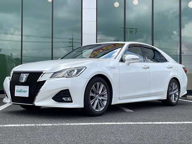 トヨタ クラウン ハイブリッド アスリートS 福岡県 2015(平27)年 8.1万km ホワイトパールクリスタルシャイン ・サンルーフ/・純正メーカーナビ　フルセグ　DVD再生/・純正バックカメラ/・純正１７インチアルミホイル/・スマートキー/・ETC車載機/・純正フロアマット/・純正ドアバイザー/・クルーズコントロール追従走行有/・純正17インチアルミホイル/・サイドエアバック/・コーナーセンサー