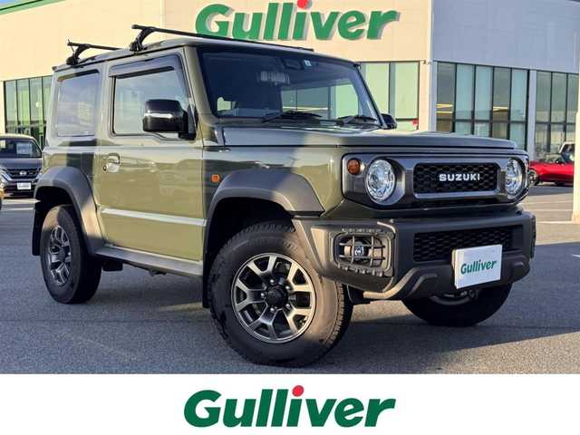 スズキ ジムニー シエラ JC 奈良県 2023(令5)年 1.8万km ジャングルグリーン carrozzeriaディスプレイオーディオ/（BT/AppleCarPlay/AndroidAut）/レーダークルズコントロール/バックカメラ/衝突軽減システム/レーンキープアシスト/前席シートヒーター/ルーフキャリア/デジタルインナーミラー/ステアリングスイッチ/LEDヘッドライト/オートライト/ヘッドライトウォッシャー/ETC/前後ドライブレコーダー/純正15インチAW/保証書/取り扱い説明書/スペアキーX1