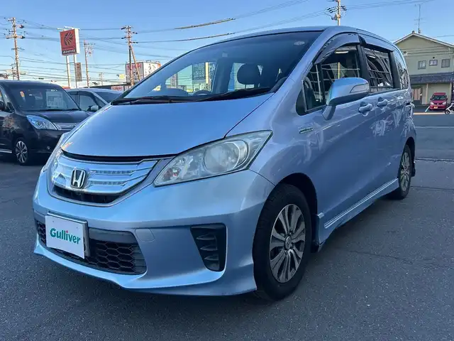 ホンダ フリード ハイブリット ジャストセレクション 静岡県 2013(平25)年 12万km プレミアムブルーオパールメタリック ストラーダナビ/CD/DVD/Bluetooth/クルーズコントロール/両側パワースライドドア/フルセグ/ドライブレコーダー/純正フロアマット/純正アルミホイール/ハーフレザーシート/ETC