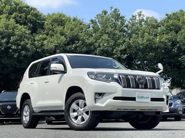 トヨタ ランドクルーザー プラド TX 東京都 2018(平30)年 8.8万km ホワイトパールクリスタルシャイン ワンオーナー/サンルーフ/クリアランスソナー前後/純正メモリナビ（NSZT-W66T）/・フルセグTV/Bluetoothオーディオ/DVD/バックカメラ/ドライブレコーダー前後（DRV-MR740）/Toyota Safety Sense/・プリクラッシュセーフティ/・レーンディパーチャーアラート/・オートマチックハイビーム/・レーダークルーズコントロール/純正アルミホイール17インチ/純正フロアマット/保証書/取扱説明書/スペアキー