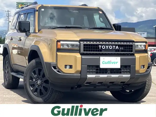 トヨタ ランドクルーザー ２５０ VX ファーストエディション 道南・函館 2024(令6)年 1.6万km 茶 純正ナビ【T-Connect】/　AM/FM/USB/Bluetooth/ETC2.0/フルセグテレビ/アラウンドビューモニター/プッシュスタート/スペアキー/4WD/レザーシート/シートヒーター【D席/N席】/シートエアコン【D席/N席】/パワーシート【D席】/電動パーキングブレーキ/サンルーフ/電動リアゲート/電動格納ウィンカーミラー/純正フロアマット/純正アルミホイール18インチ/純正LEDヘッドライト/フォグランプ/Toyota Safety Sense/　・衝突軽減ブレーキ/　・プロアクティブドライビングアシスト/　・レーダークルーズコントロール/　・ブラインドスポットモニター/　・パノラミックビューモニター/置くだけ充電/JBL/ドアバイザー