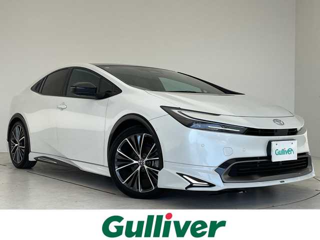 トヨタ プリウス Z 愛知県 2023(令5)年 2.2万km プラチナホワイトパールマイカ モデリスタエアロパーツ/純正１２．４型ディスプレイオーディオ（ナビあり）/全方位カメラ/ガラスルーフ/レーダークルーズコントロール/シートヒーター/エアシート/バックカメラ/電動リアゲート/パワーシート/コーナーセンサー/純正アルミホイール/ETC２．０/ブラインドスポットモニター/LEDヘッドライト/ステアリングヒーター/インテリジェントミラー/オートマチックハイビーム/ワイヤレス充電器/ドライブレコーダー/衝突軽減システム/フルセグ/Bluetooth