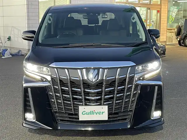 トヨタ アルファード S Cパッケージ 広島県 2021(令3)年 2.3万km ブラック 登録時走行距離/　22214km/ワンオーナー/純正メモリーナビ/　【CD/DVD/BT/USB/Miracast/フルセグTV】/純正フリップダウンモニター/バックカメラ/クルーズコントロール(追従走行有り)/衝突被害軽減ブレーキ(プリクラッシュセーフティ：PCS)/パーキングサポートブレーキ/　(後方衝突被害軽減ブレーキ：PKSB)/車線逸脱警報(レーンディバーチャーアラート：LTA)/両側パワースライドドア/パワーバックドア/ビルトインETC/前後ドライブレコーダー/１列目２列目パワーシート/シートヒーター／エアシート/オットマン/１００V電源/ステアリングヒーター/デジタルインナーミラー/オートワイパー/オートライト/純正LEDライト/フォグランプ/スマートキー/スペアキー/エンジンスタートボタン/横滑り防止装置/カーテンエアバッグ/純正フロアマット/保証書