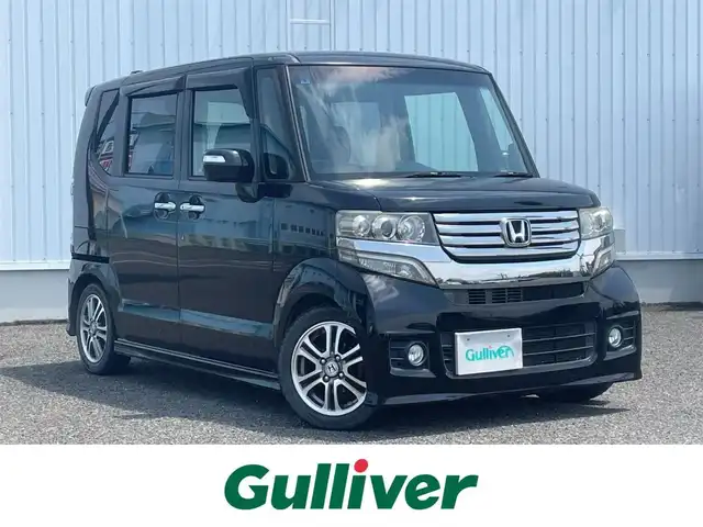 ホンダ Ｎ ＢＯＸ カスタム G Lパッケージ 熊本県 2013(平25)年 17.4万km クリスタルブラックパール 社外ナビ/・AM/FM/CD/DVD/・フルセグTV/・バックカメラ/片側パワースライドドア/横滑り防止装置/ステアリングスイッチ/オートライト/フォグランプ/電動格納ミラー/ウインカーミラー/ドアバイザー/純正フロアマット/純正アルミホイール/プッシュスタート/スペアキー