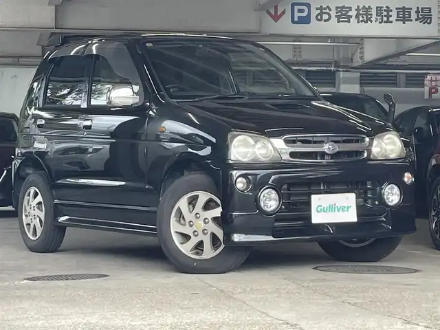 ダイハツ テリオス キッド テリオスキッド×キスマーク X 愛知県 2006(平18)年 7.7万km ブラックマイカ 社外ナビ(FM/AM/CD/DVD/SD/HDD/ipod)/ハロゲンライト/ドアバイザー/純正フロアマット/電動格納ミラー/板キー