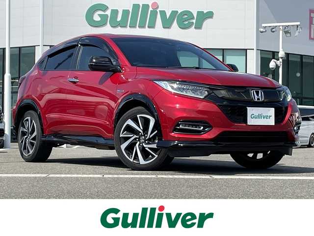 ホンダ ヴェゼル ハイブリッド RS ホンダセンシング 佐賀県 2020(令2)年 5.5万km プレミアムクリスタルレッドM ワンオーナー/純正メモリナビ/・フルセグTV/CD/DVD/SD/USB/Bluetooth/バックカメラ/前方ドライブレコーダー/ビルトインETC/パドルシフト/電子パーキングブレーキ/BRAKE HOLD機能/ハーフレザーシート/D＋N席シートヒーター/ISOFIX対応/革巻きステアリング/ステアリングリモコン/純正18インチアルミホイール/純正LEDヘッドライト/純正LEDフォグライト/純正フロアマット/純正ドアバイザ―/新車保証書/取扱説明書/スペアキー１本/ホンダセンシング/・アダプティブクルーズコントロール/・衝突被害軽減ブレーキ/・路外逸脱抑制機能/・先行車発進お知らせ機能/・リアクティブフォースペダル/・標識認識機能