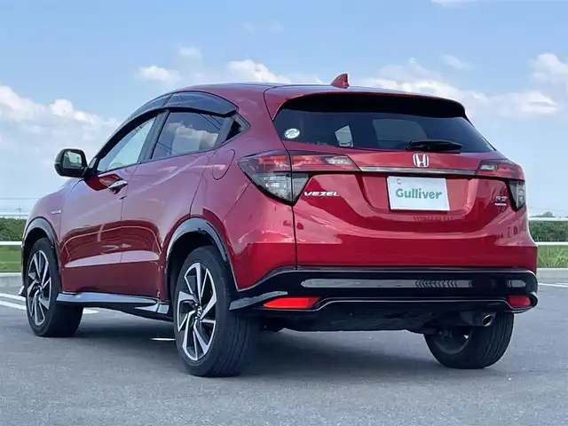 ホンダ ヴェゼル ハイブリッド RS ホンダセンシング 佐賀県 2020(令2)年 5.5万km プレミアムクリスタルレッドM ワンオーナー/純正メモリナビ/・フルセグTV/CD/DVD/SD/USB/Bluetooth/バックカメラ/前方ドライブレコーダー/ビルトインETC/パドルシフト/電子パーキングブレーキ/BRAKE HOLD機能/ハーフレザーシート/D＋N席シートヒーター/ISOFIX対応/革巻きステアリング/ステアリングリモコン/純正18インチアルミホイール/純正LEDヘッドライト/純正LEDフォグライト/純正フロアマット/純正ドアバイザ―/新車保証書/取扱説明書/スペアキー１本/ホンダセンシング/・アダプティブクルーズコントロール/・衝突被害軽減ブレーキ/・路外逸脱抑制機能/・先行車発進お知らせ機能/・リアクティブフォースペダル/・標識認識機能