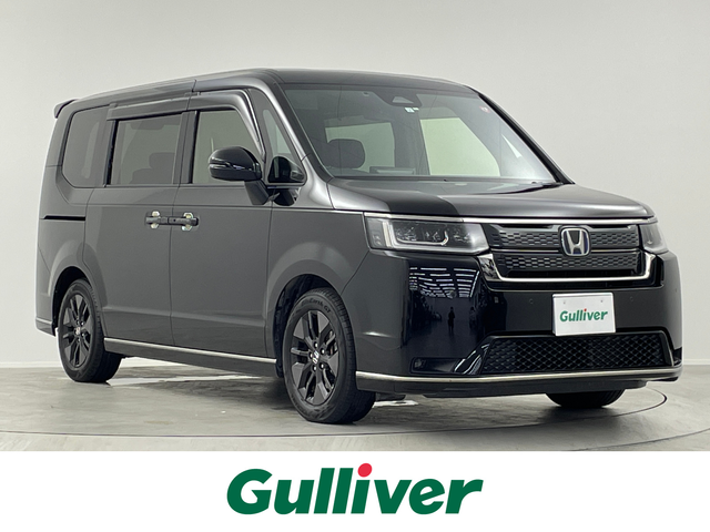 ホンダ ステップワゴン スパーダ eHEV 埼玉県 2023(令5)年 4万km クリスタルブラックパール 純正１１．４型ナビ　Ｂｌｕｅｔｏｏｔｈ　ＴＶ　後席モニター　オットマン　　ハーフレザーシート　シートヒーター　両側パワースライドドア　電動リアゲート　オートハイビーム　　スペアキー　ビルトインＥＴＣ