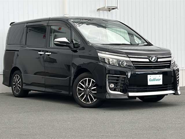 トヨタ ヴォクシー ZS 煌Ⅱ 三重県 2016(平28)年 9.2万km ブラック 純正9型ナビ　/純正12.1型後席モニター　/バックカメラ　/ビルトインETC2.0　/両側パワースライドドア　/前方ドライブレコーダー　/レーンキープアシスト　/衝突軽減ブレーキ/アイドリングストップ/純正フロアマット　/オートハイビーム /オートライト/革巻きステアリング/ステアリングスイッチ/電動格納ミラー/禁煙車