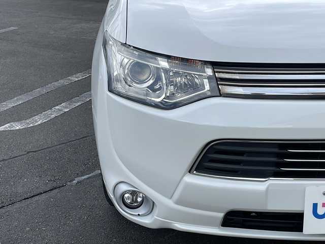三菱 アウトランダー ＰＨＥＶ G セーフティパッケージ 長野県 2014(平26)年 6.6万km シルキーホワイト (株)IDOMが運営する【じしゃロン長野店】の自社ローン専用車両になります/こちらは現金またはオートローンご利用時の価格です。自社ローンご希望の方は別途その旨お申付け下さい./社外ナビ（CD/DVD/BT）/バックカメラ/HIDヘットライト/４WD/ステアリングスイッチ/クルーズコントロール/パドルシフト