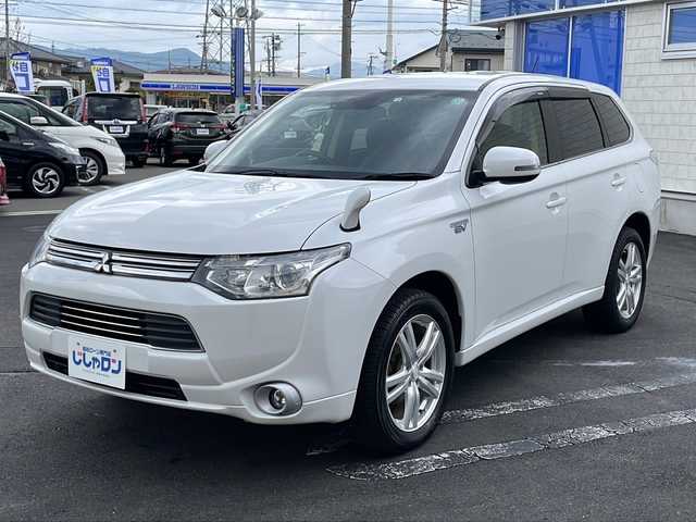 三菱 アウトランダー ＰＨＥＶ G セーフティパッケージ 長野県 2014(平26)年 6.6万km シルキーホワイト (株)IDOMが運営する【じしゃロン長野店】の自社ローン専用車両になります/こちらは現金またはオートローンご利用時の価格です。自社ローンご希望の方は別途その旨お申付け下さい./社外ナビ（CD/DVD/BT）/バックカメラ/HIDヘットライト/４WD/ステアリングスイッチ/クルーズコントロール/パドルシフト