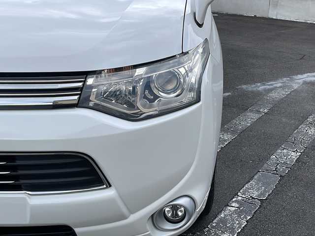 三菱 アウトランダー ＰＨＥＶ G セーフティパッケージ 長野県 2014(平26)年 6.6万km シルキーホワイト (株)IDOMが運営する【じしゃロン長野店】の自社ローン専用車両になります/こちらは現金またはオートローンご利用時の価格です。自社ローンご希望の方は別途その旨お申付け下さい./社外ナビ（CD/DVD/BT）/バックカメラ/HIDヘットライト/４WD/ステアリングスイッチ/クルーズコントロール/パドルシフト