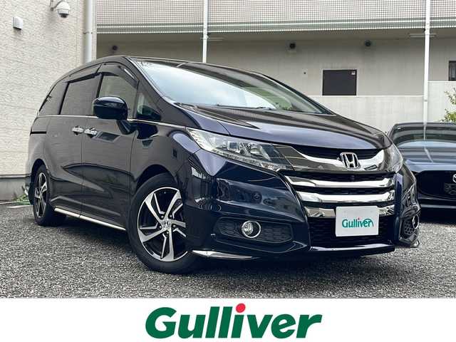 ホンダ オデッセイ アブソルート・Xホンダセンジング 兵庫県 2016(平28)年 3.5万km プレミアムヴィーナスブラックP 純正メモリナビ/Bluetooth・AM/FM・HDMI・USB・CD・DVD・Ipod/フルセグTV//両側パワースライドドア/3列シート/ビルトインETC/オットマン/マルチビューカメラシステム/ドライブレコーダー/パーキングアシスト/アンチロック・ブレーキ・システム/衝突被害軽減システム/盗難防止装置/横滑り防止装置/前後コーナーセンサー/エアバッグ(W＋サイド)/カーテンエアバッグ/LEDルームランプ/LEDヘッドライト/純正アルミホイール/純正フロアマット/オートライト/プッシュスタート/スマートキー/取扱説明書